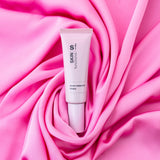 Skin Functional tube labeled 'Skin Functional' on a pink fabric background